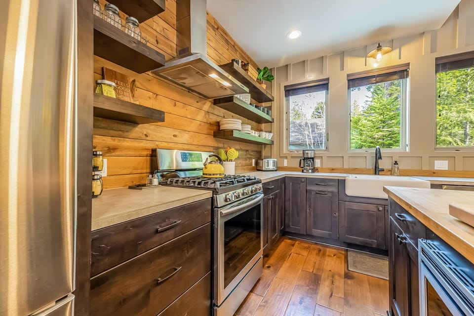 Modern Kitchen with a 5 Burner Gas Cooktop across the appealing center island