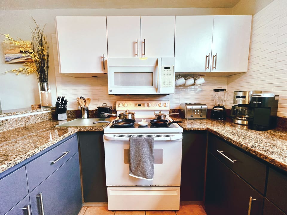 The fully equipped kitchen features modern appliances for great meals.