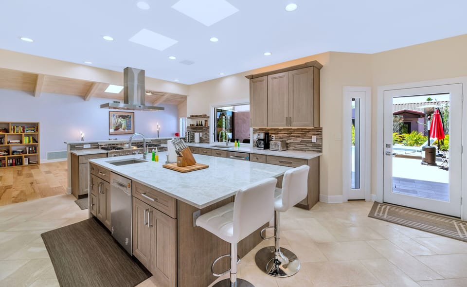 Gourmet Kitchen: Limestone floor leads to large outdoor covered patio and pool
