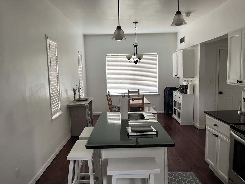 Dining area, kitchen table and island.