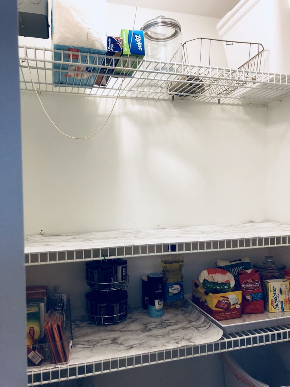 Pantry with coffee, tea, spices, sugar and basics