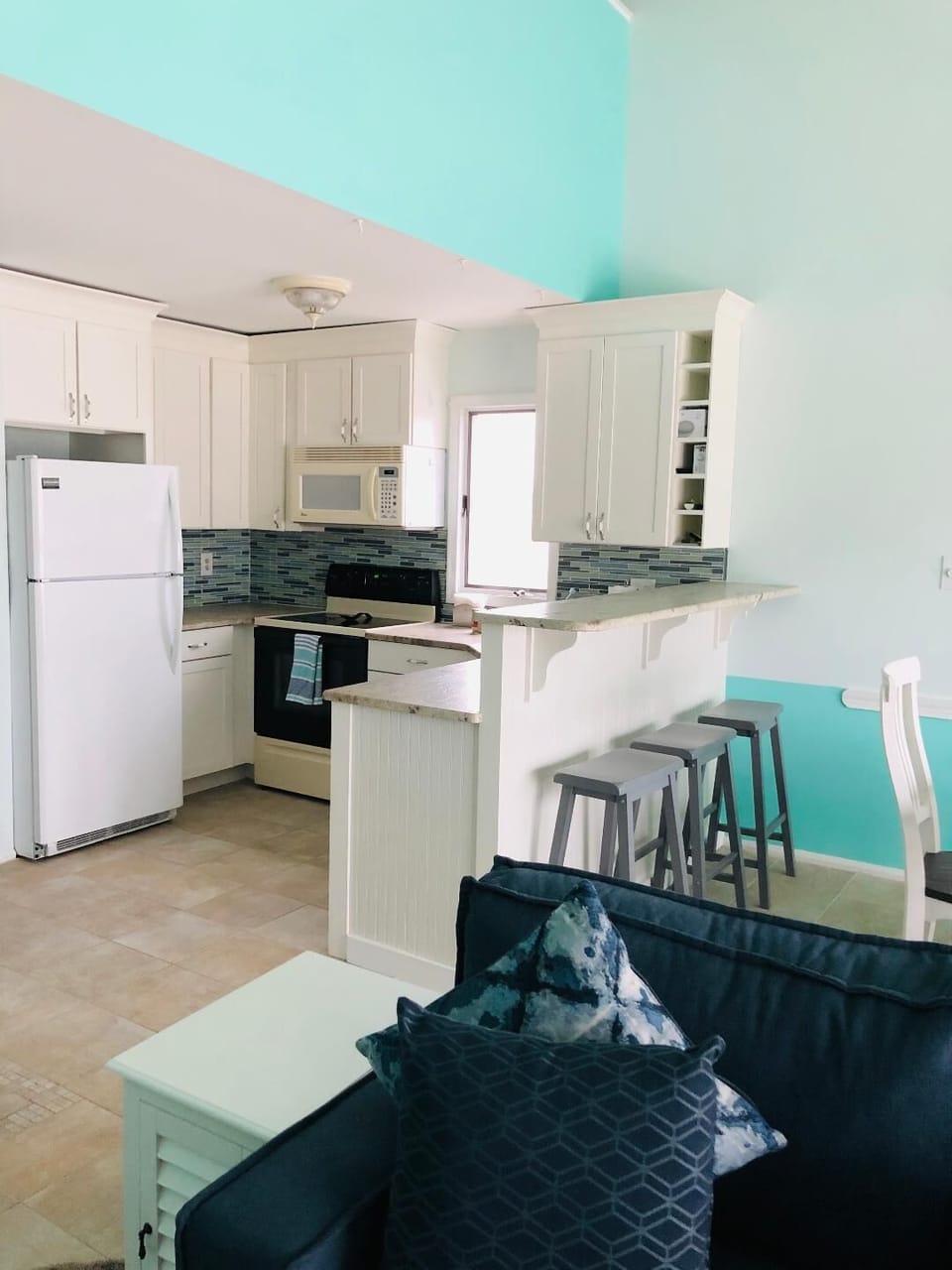 Kitchen With Counter and Stools