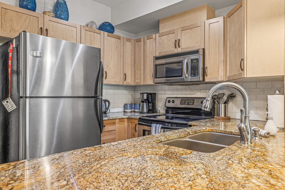 Fully Stocked Kitchen w/ beautiful granite counters and Stnls Steel Appliances. 