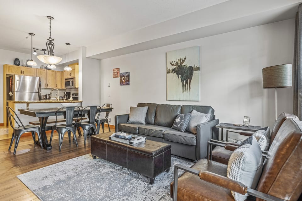Open-concept Living Room to Dining Area and Kitchen. 