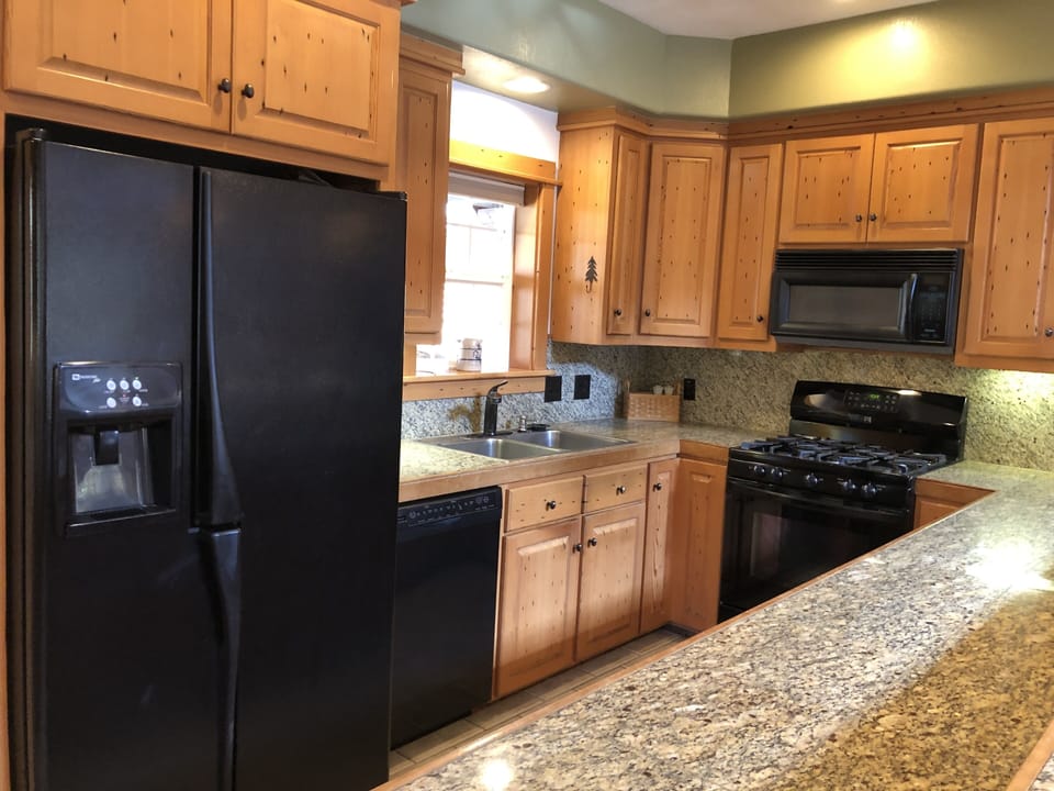 Gas stove, dish washer, large refrigerator, & microwave make meal prep. easy.

