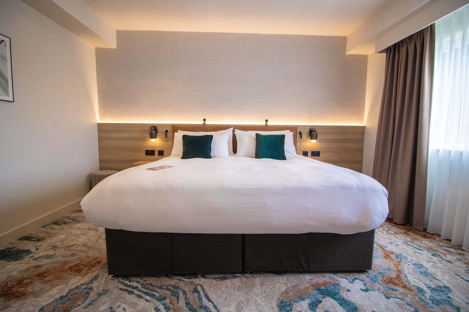 Premium bedding, desk, blackout drapes, iron/ironing board