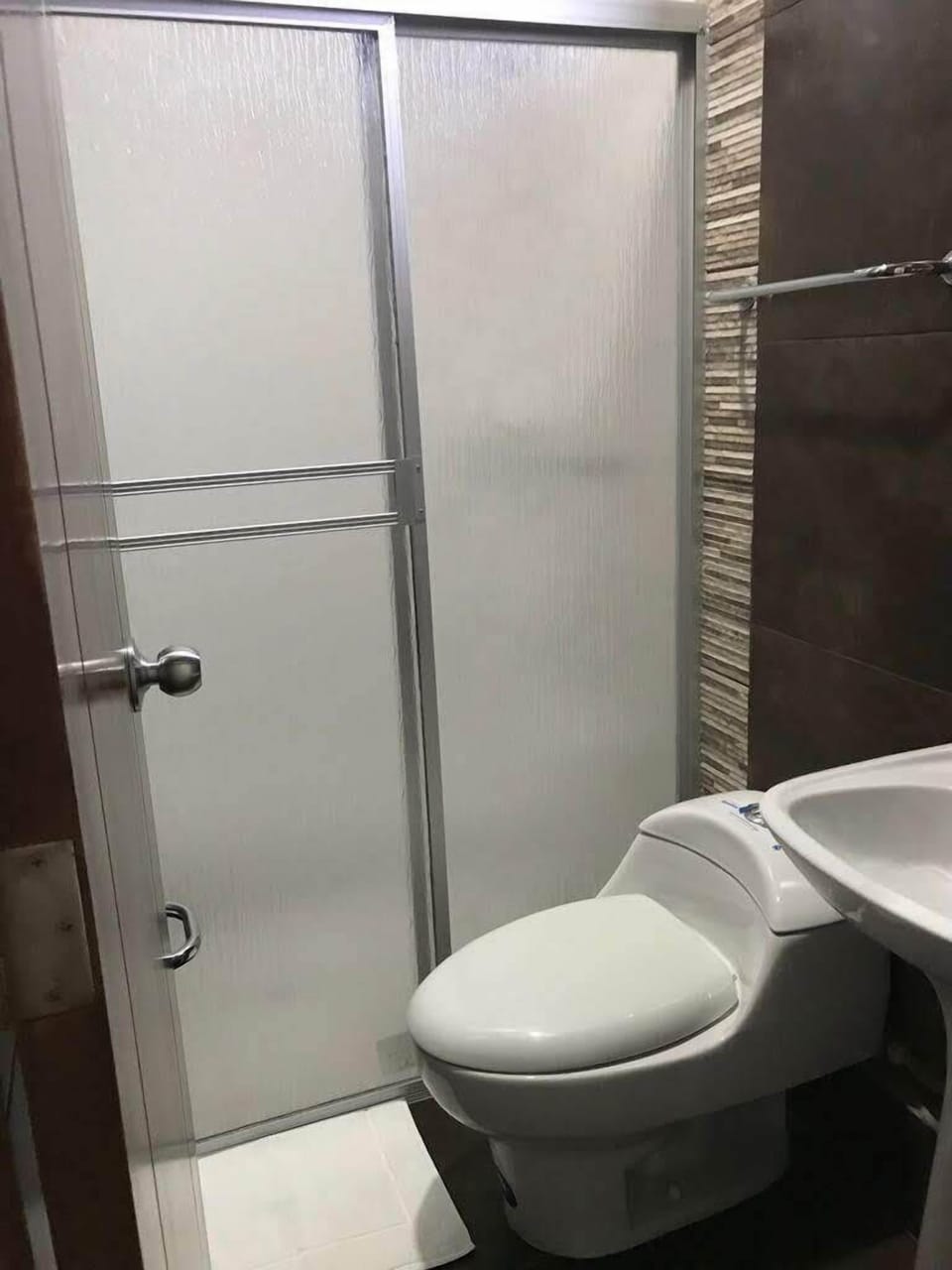 Shower, rainfall showerhead, towels, soap