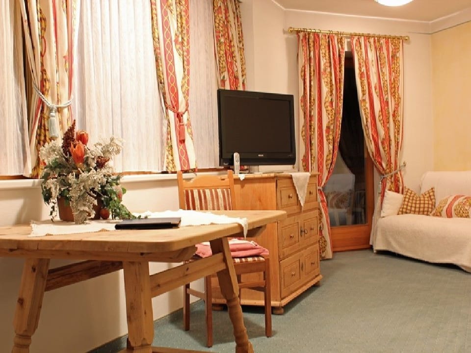 Family Suite, Balcony | Living area | Smart TV, heated floors