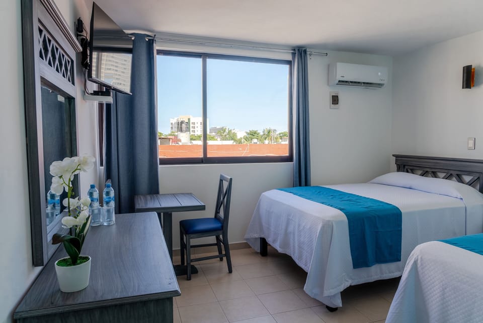 Standard Room, 2 Double Beds | 1 bedroom, down comforters, desk, blackout drapes