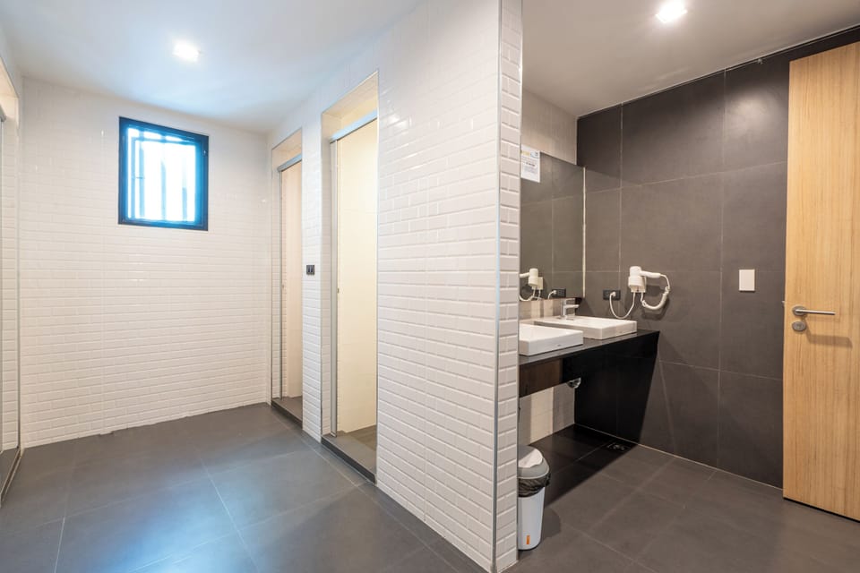4-Bed Mixed Dormitory | Bathroom | Shower, hair dryer, towels, soap