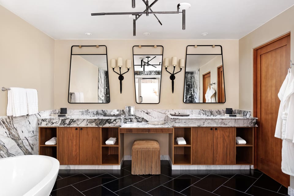 Separate tub and shower, designer toiletries, hair dryer, bathrobes