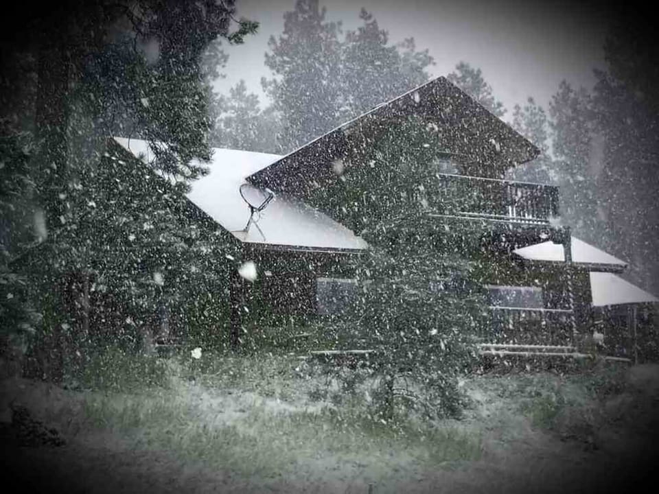 Snowy view of the front of the home