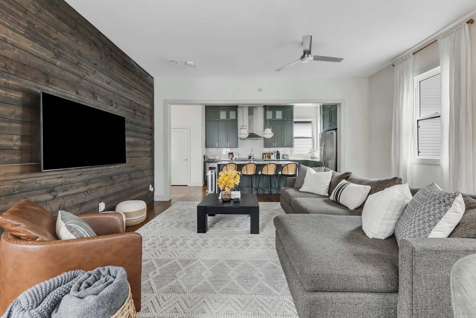 Relaxing lounge area with large TV and stylish finishes.