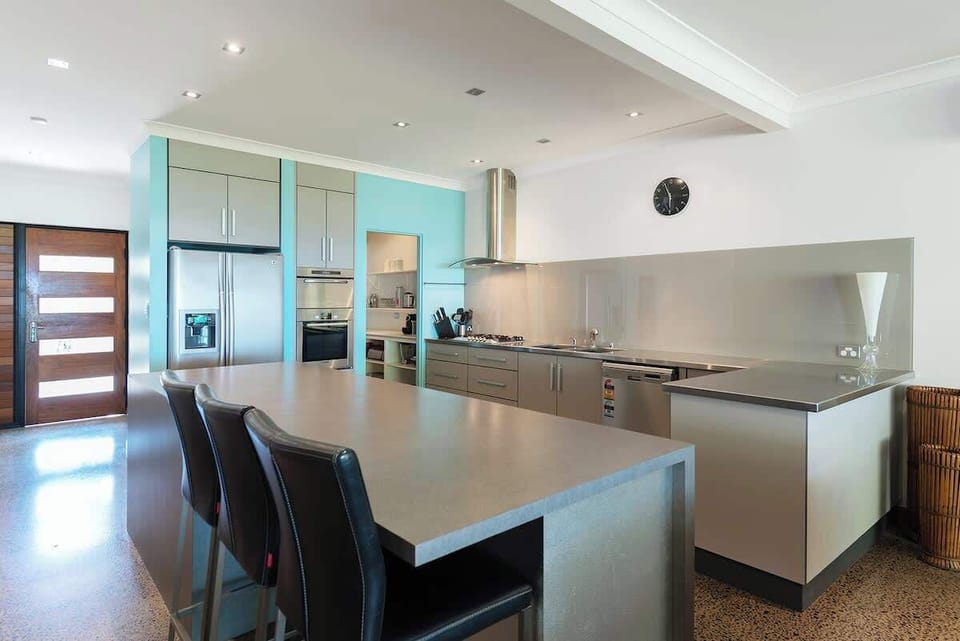 The modern kitchen is fully equipped to cook up a storm with ample counter space to work with.