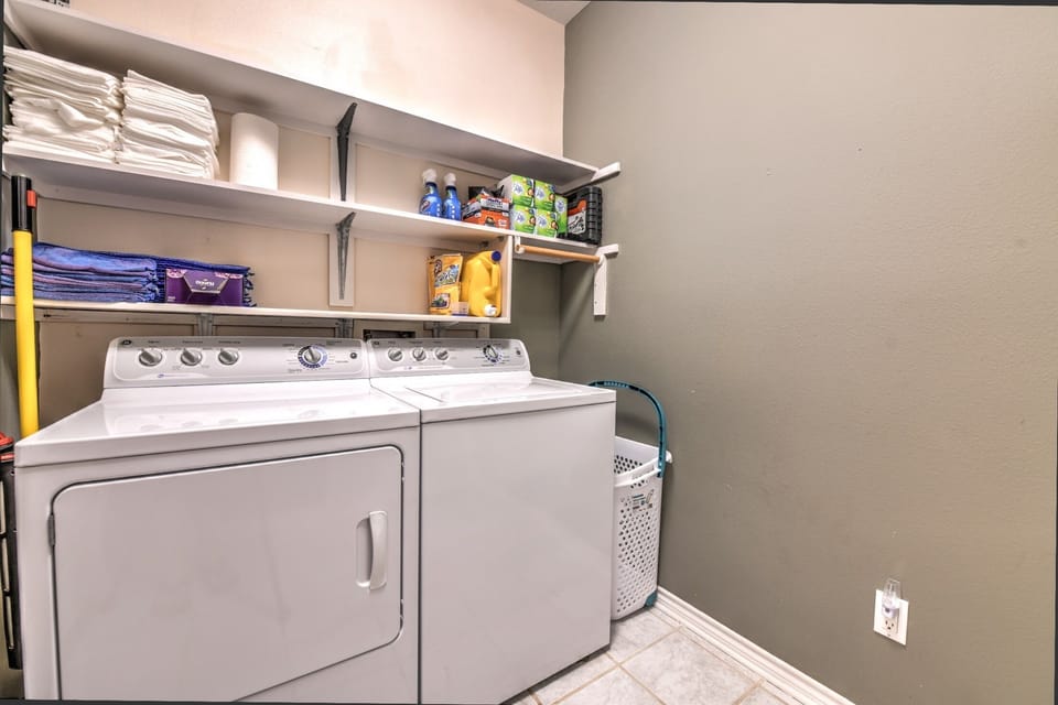 Washer & dryer with laundry detergent (or pods) 
Iron + Ironing board as well