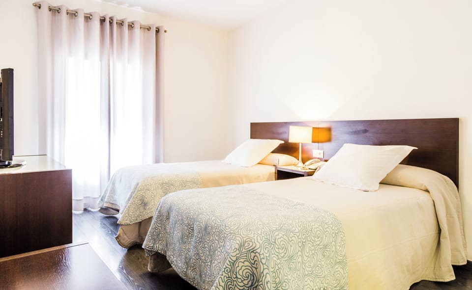 Superior Twin Room | Desk, blackout drapes, iron/ironing board, free WiFi