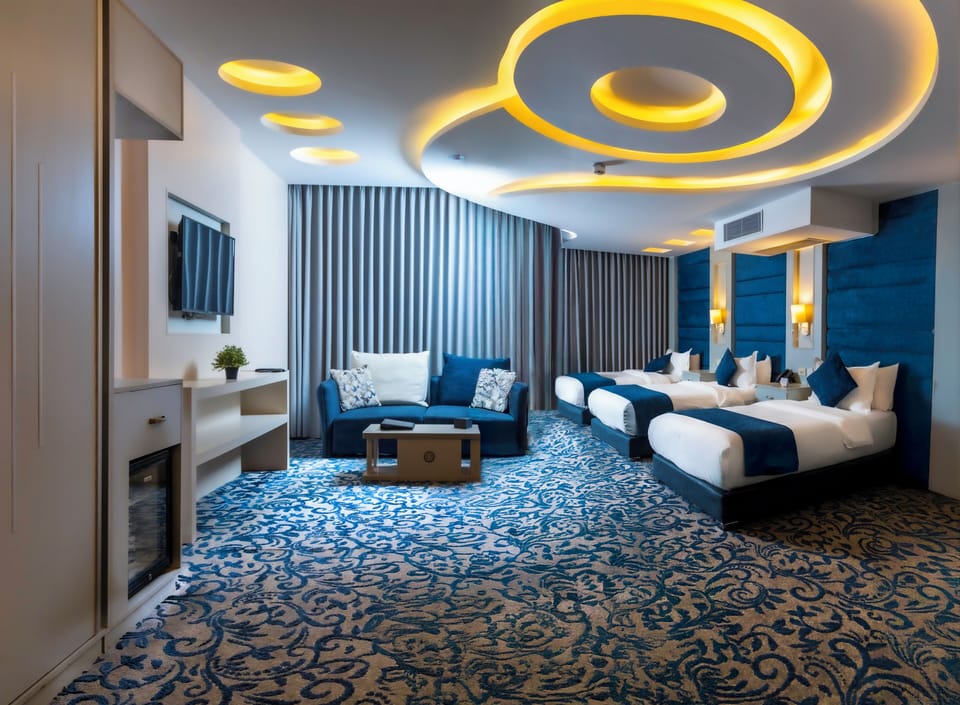 Triple Room | Minibar, in-room safe, blackout drapes, soundproofing