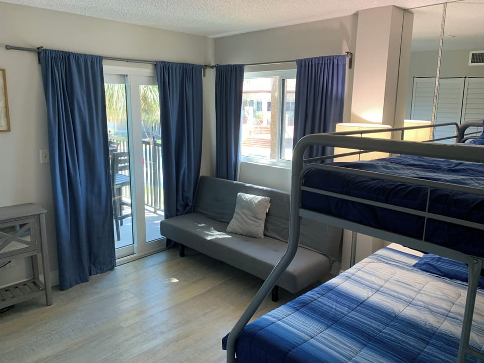 Bunk bed has a double on the bottom and twin on top.  Futon folds flat.