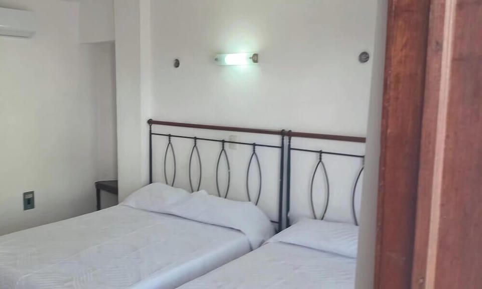 Down comforters, desk, WiFi (free), bed sheets