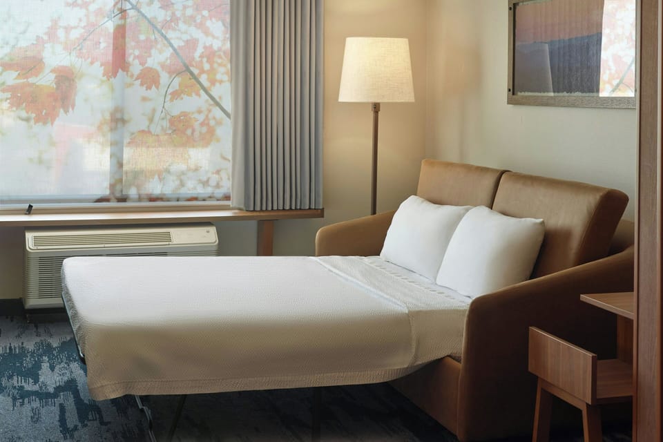 Desk, laptop workspace, blackout drapes, iron/ironing board