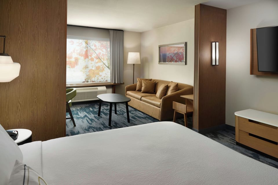 Desk, laptop workspace, blackout drapes, iron/ironing board