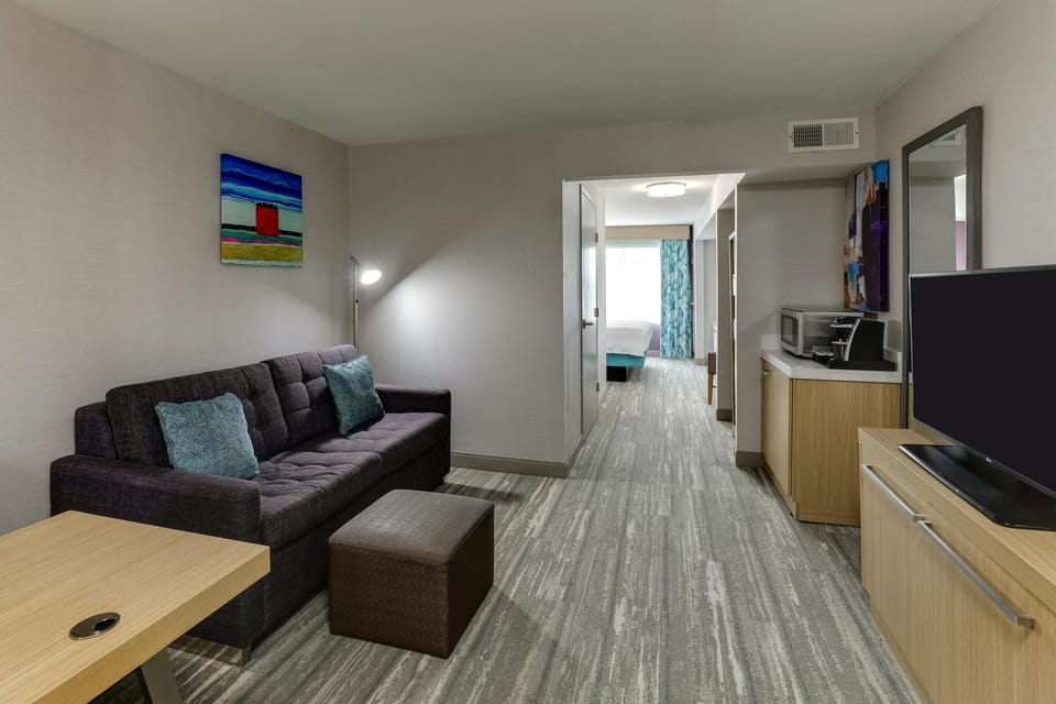 Junior Suite, 1 King Bed with Sofa bed | Living area | 49-inch LCD TV with cable channels, TV, pay movies