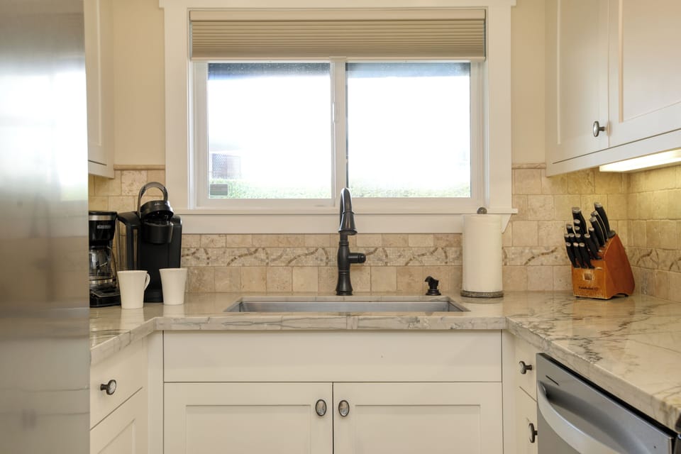 This kitchen is the perfect space to gather, cook, and enjoy the laid-back beach lifestyle.