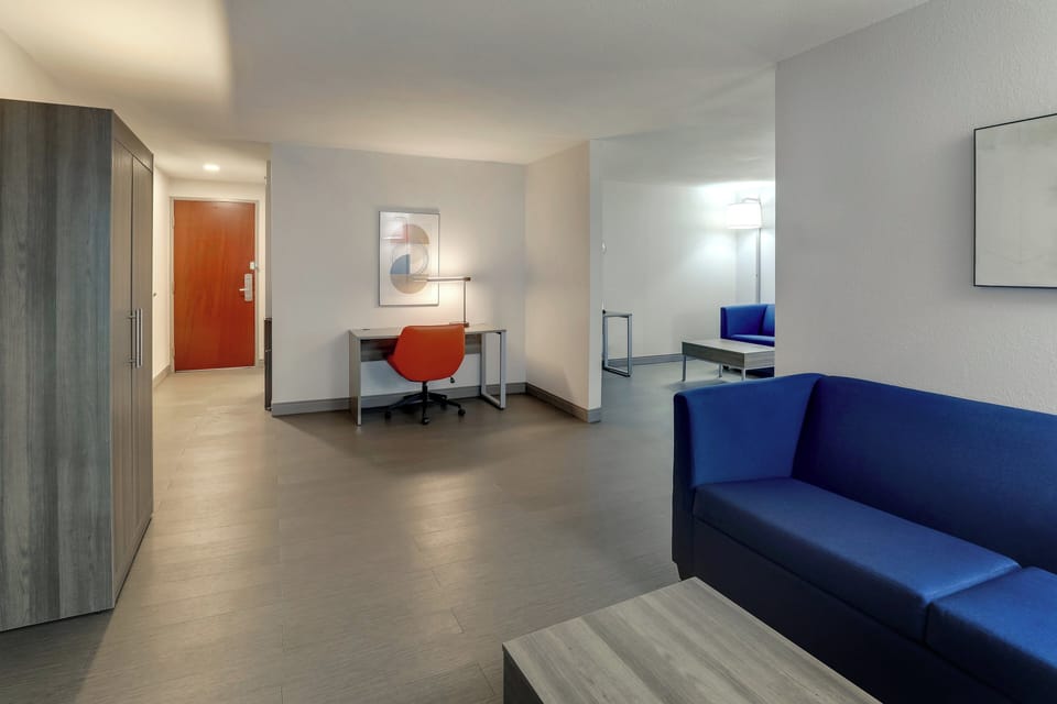 Suite, 1 King Bed with Sofa bed | In-room safe, desk, laptop workspace, iron/ironing board