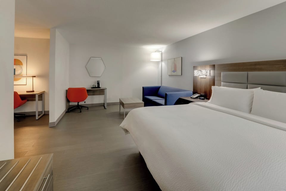 Suite, 1 King Bed with Sofa bed | In-room safe, desk, laptop workspace, iron/ironing board