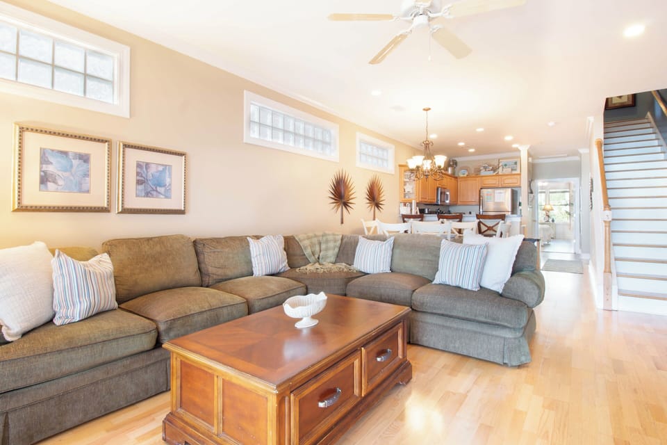 Sink into this spacious sectional sofa where you'll love gathering with family in your bright, open-concept living space.