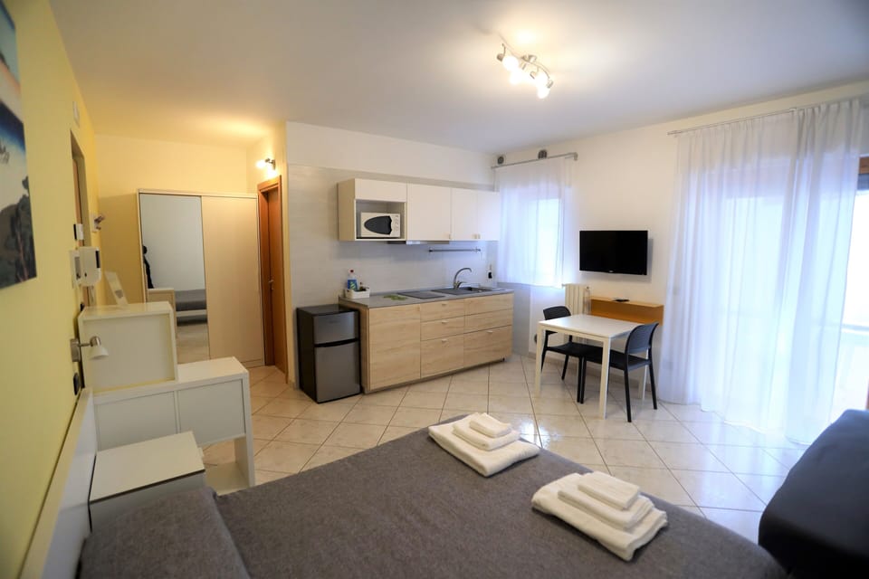 Deluxe Studio Suite, 1 Queen Bed (Art Room) | Living area | Flat-screen TV