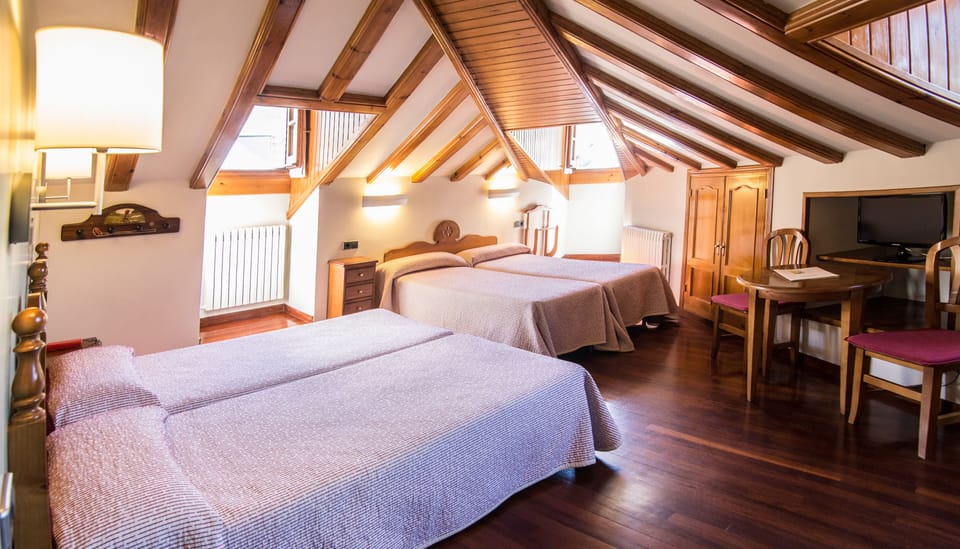 Premium bedding, desk, laptop workspace, blackout drapes