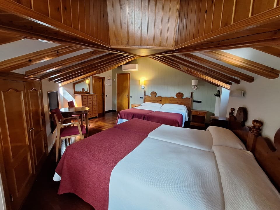 Family room 4 beds Attic Exterior | Premium bedding, desk, laptop workspace, blackout drapes