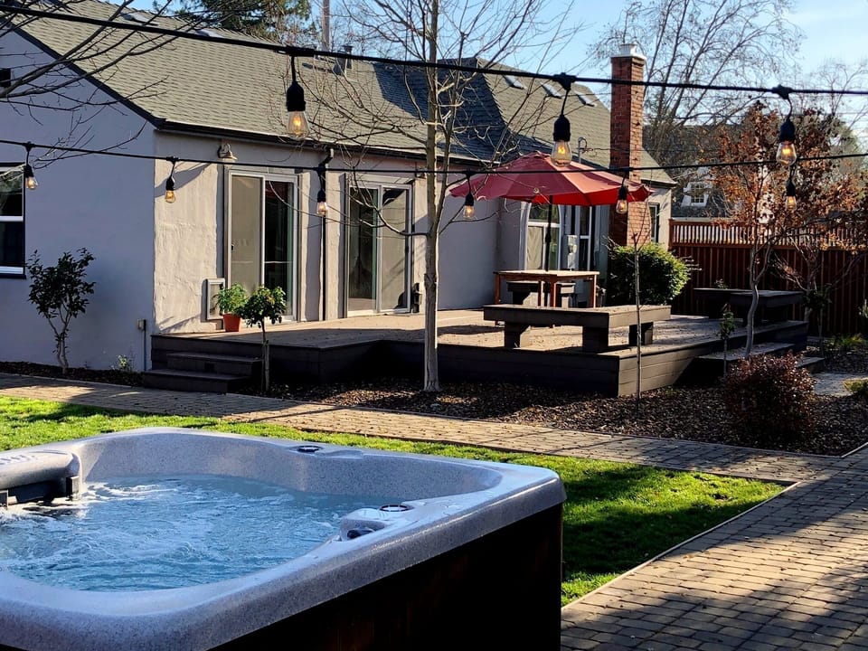 Access to the hot tub area with outdoor lights

