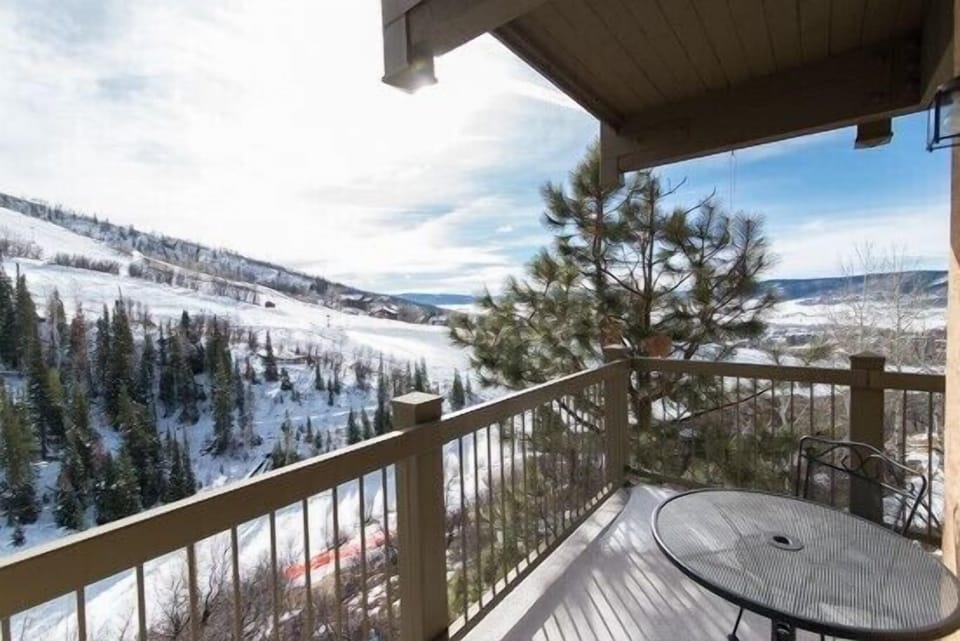 Step onto your private balcony and breathe in the crisp mountain air while soaking up stunning winter views across the snow-covered valley.