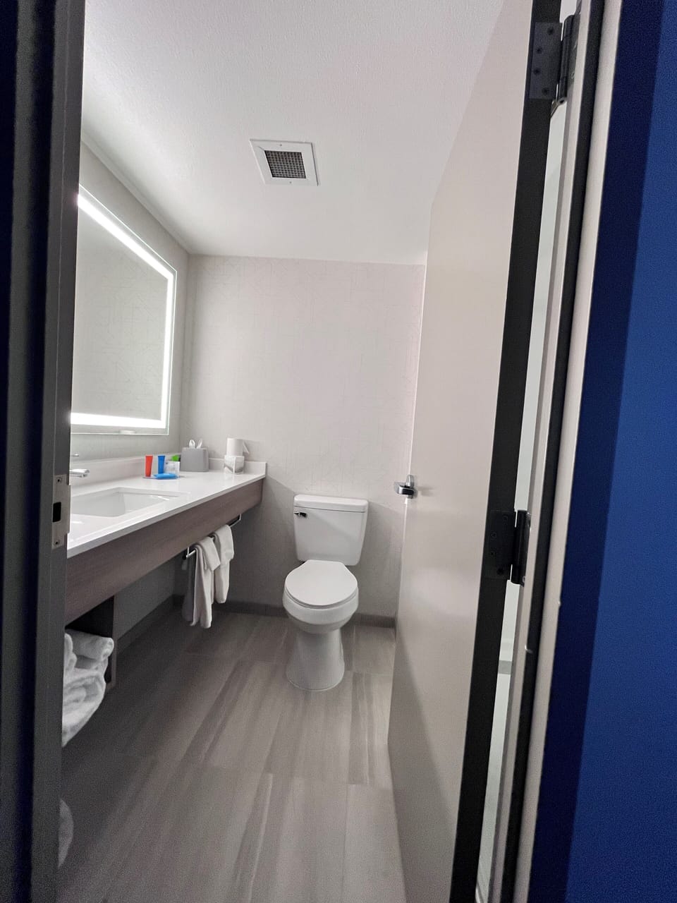 Shower, designer toiletries, hair dryer, towels