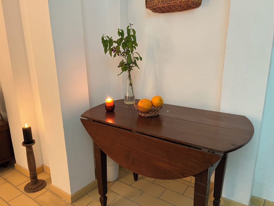 Extra table in the kitchen where you can find linens.
