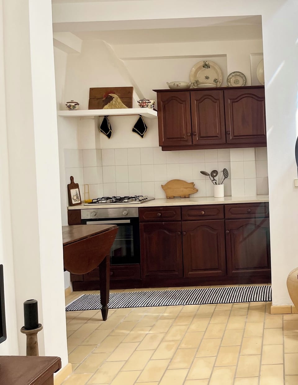 The kitchen has a large countertop and has new equipment.