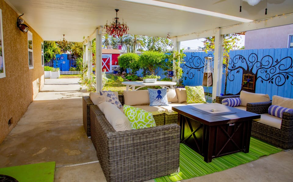 Outdoor covered patio with chandeliers & heaters