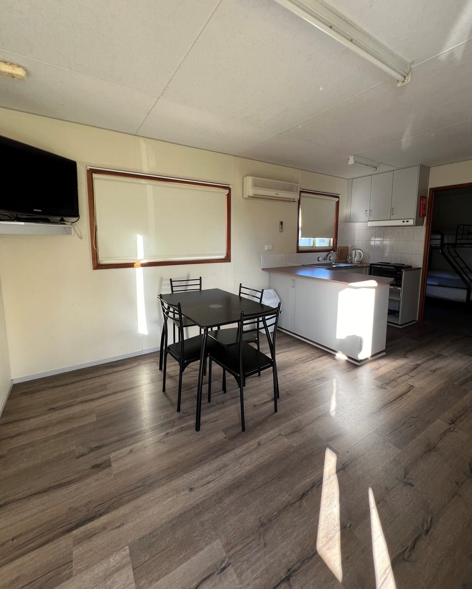 Deluxe Cabin, Pets Not Allowed | Living area | Flat-screen TV, DVD player