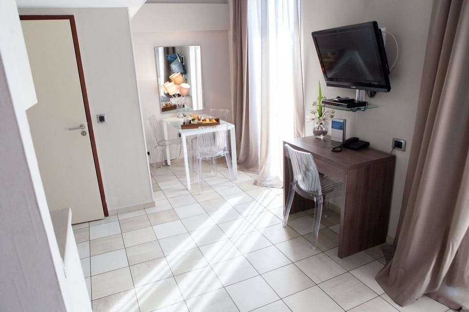 Duplex | Living area | 120-cm flat-screen TV with satellite channels, TV