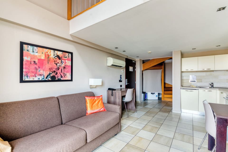 Superior Duplex | Living area | 120-cm flat-screen TV with satellite channels, TV
