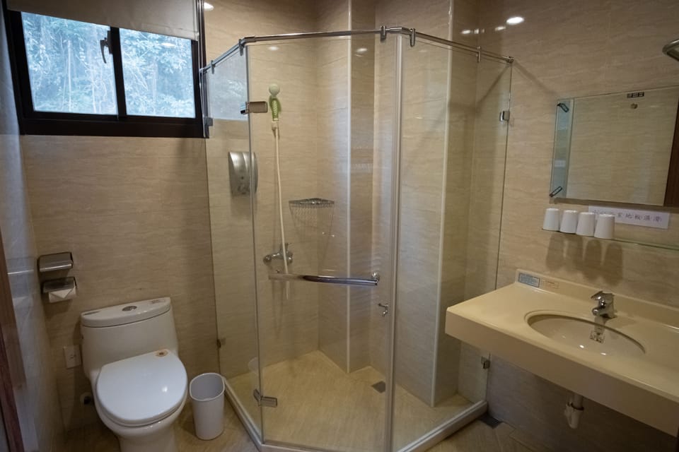Quadruple Room | Bathroom | Shower, free toiletries, hair dryer, slippers