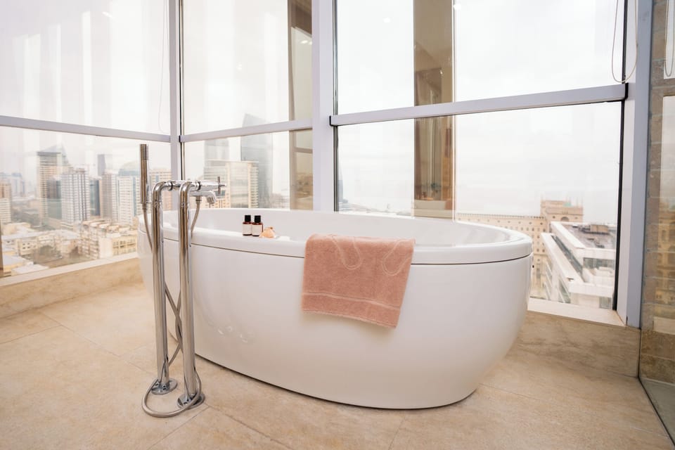 Junior Suite | Bathroom | Rainfall showerhead, designer toiletries, hair dryer, bathrobes