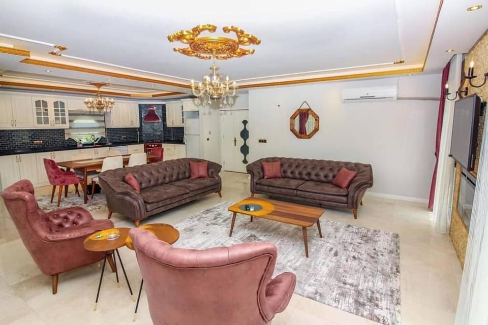 Business Villa, 4 Bedrooms | Living room | 120-cm LCD TV with satellite channels, TV, fireplace