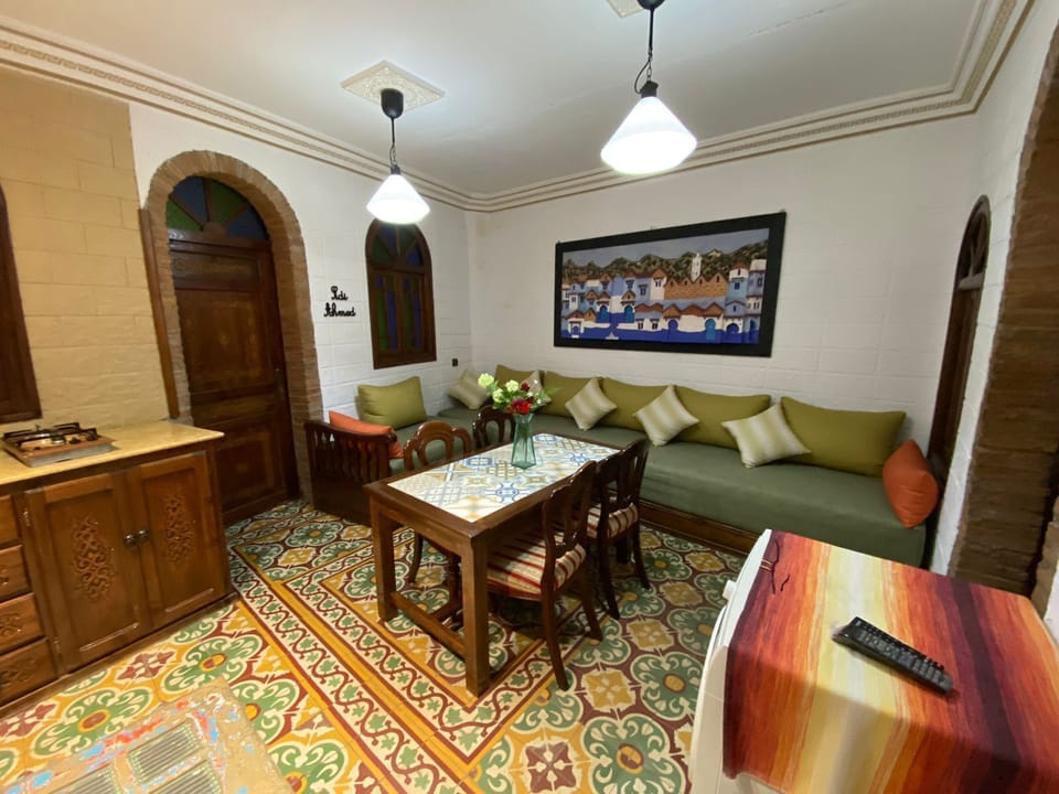 Deluxe House | Living area | 35-inch flat-screen TV with satellite channels, TV, first-run movies