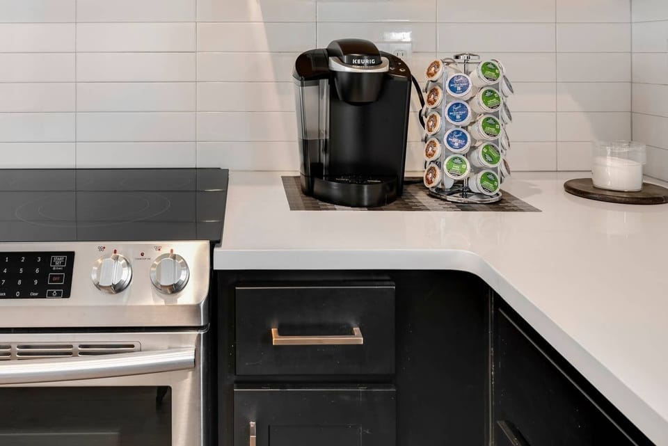 There's a Keurig and a supply of coffee K-cups, sugar, and vanilla creamer because... priorities.