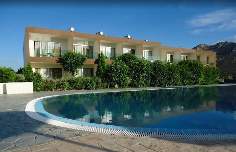 Seasonal outdoor pool, open 10:00 AM to 6:00 PM, pool umbrellas