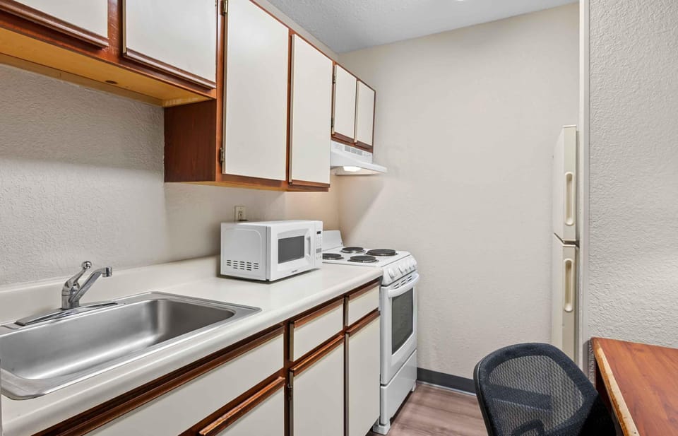 Fridge, microwave, stovetop, cookware/dishes/utensils