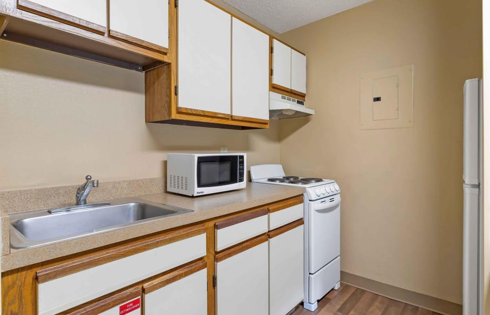 Deluxe Studio, Multiple Beds, Non Smoking | Private kitchen | Coffee/tea maker, full-size fridge, microwave, oven
